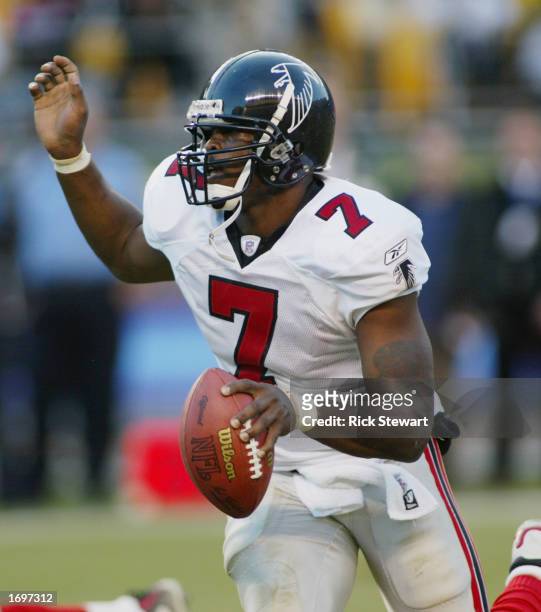 Quarterback Michael Vick of the Atlanta Falcons scrambles during a game against the Pittsburgh Steelers on November 10, 2002 at Heinz Field in...