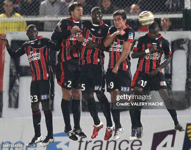 Nice's Drissa Diakite, Renato Civelli, Kevin Gomis, Xavier Pentecote and Franck Dja Djedje try to stop a free kick during their French League...