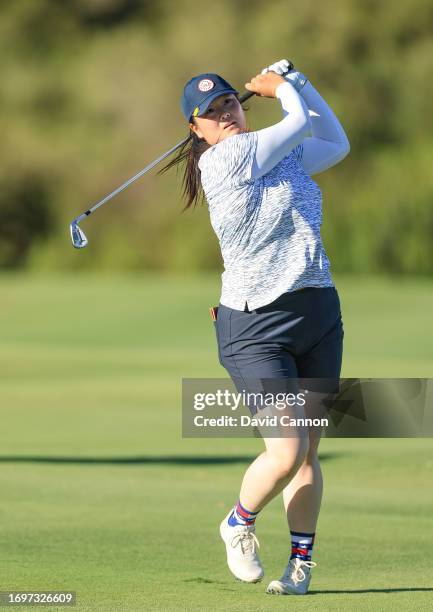 Angel Yin of The United States Team plays her second shot on the 15th hole in her match with Cheyenne Knight against Caroline Hedwall and Anna...