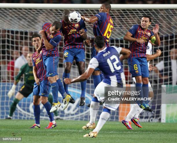 Porto's Brazilian forward Hulk takes a free kick in front of a Barcelona's players wall during the UEFA Super Cup football match FC Barcelona vs FC...