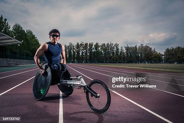 wheelchair athlete racing - wheelchair athlete stock pictures, royalty-free photos & images