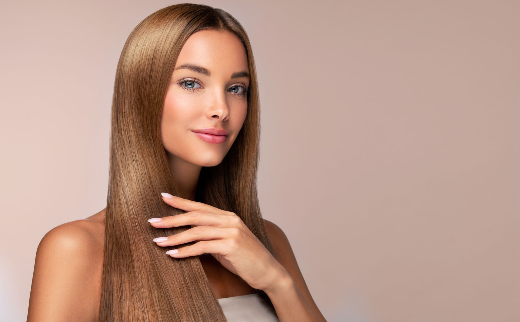 Portrait of woman with perfect long straight hair in a natural color. Hairstyling hair care makeup and manicure. Portrait of woman with perfect long straight hair in a natural color. Hairstyling hair care makeup and manicure.