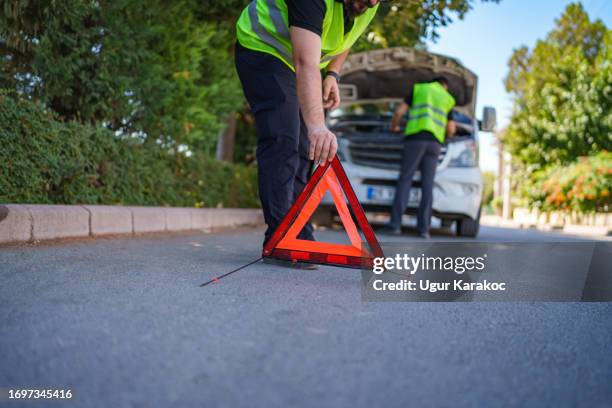 warning triangle behind van - mini van stock pictures, royalty-free photos & images