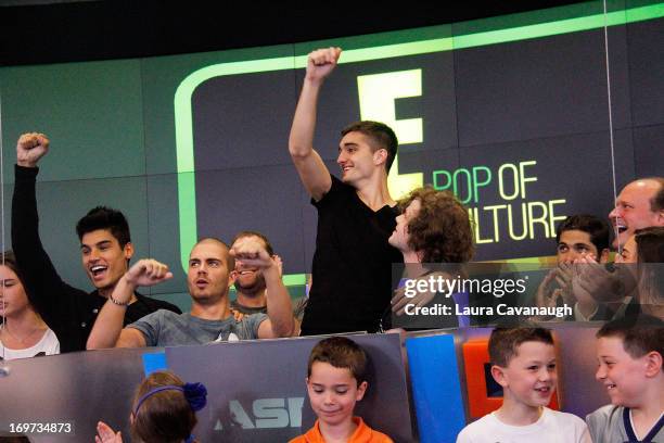 Siva Kaneswaran, Max George, Tom Parker and Jay McGuiness of The Wanted rings The NASDAQ Stock Market Closing Bell at NASDAQ MarketSite on May 31,...