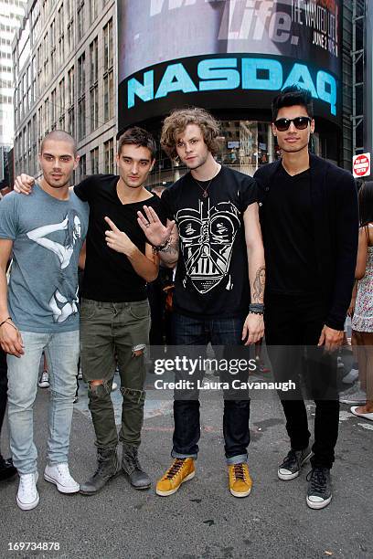 The Wanted: Max George, Tom Parker, Jay McGuiness and Siva Kaneswaran ring The NASDAQ Stock Market Closing Bell at NASDAQ MarketSite on May 31, 2013...