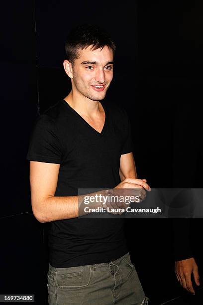 Tom Parker of The Wanted rings The NASDAQ Stock Market Closing Bell at NASDAQ MarketSite on May 31, 2013 in New York City.