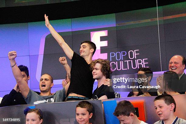 Siva Kaneswaran, Max George, Tom Parker and Jay McGuiness of The Wanted rings The NASDAQ Stock Market Closing Bell at NASDAQ MarketSite on May 31,...