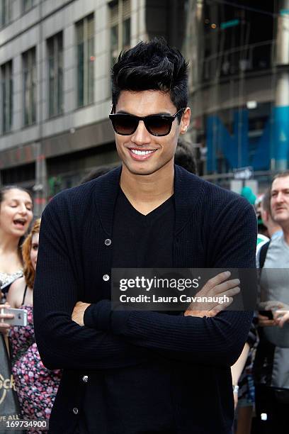 Siva Kaneswaran of The Wanted rings The NASDAQ Stock Market Closing Bell at NASDAQ MarketSite on May 31, 2013 in New York City.