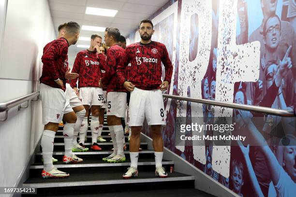 Bruno Fernandes and team mates of Manchester United line up prior to the Premier League match between Burnley FC and Manchester United at Turf Moor...