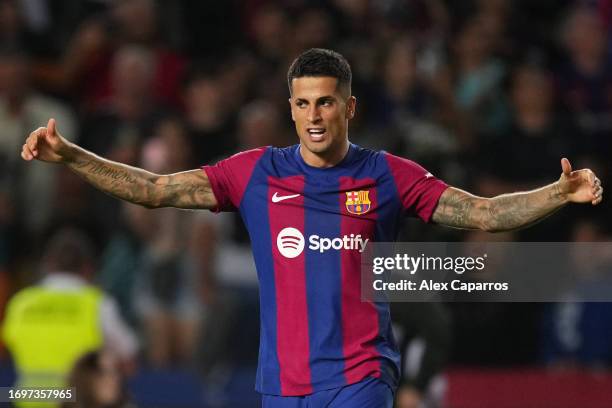 Joao Cancelo of Barcelona celebrates after scoring the team's third goal during the LaLiga EA Sports match between FC Barcelona and Celta Vigo at...