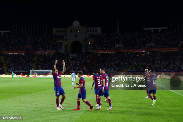 Joao Cancelo of FC Barcelona celebrates with his teammates after scoring the team's third goalduring the LaLiga EA Sports match between FC Barcelona...