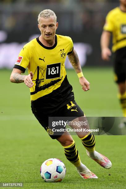 Marco Reus of Dortmund runs with the ball during the Bundesliga match between Borussia Dortmund and VfL Wolfsburg at Signal Iduna Park on September...