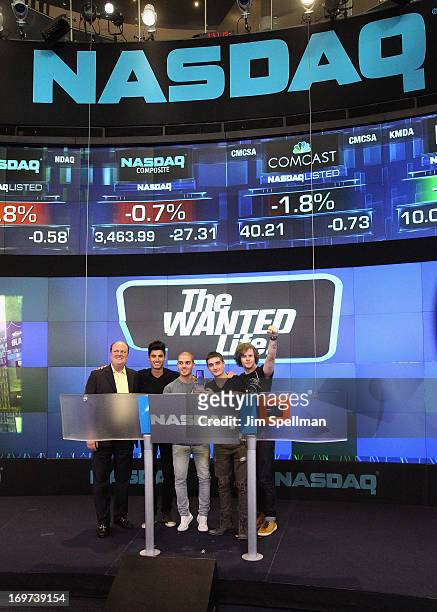 David Wicks Vice President of NASDAQ Marketsite, singers Siva Kaneswaran, Max George, Tom Parker and Jay McGuiness of The Wanted ring the closing...