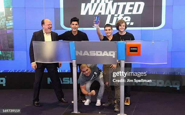 David Wicks Vice President of NASDAQ Marketsite, singers Siva Kaneswaran, Max George, Tom Parker and Jay McGuiness of The Wanted ring the closing...