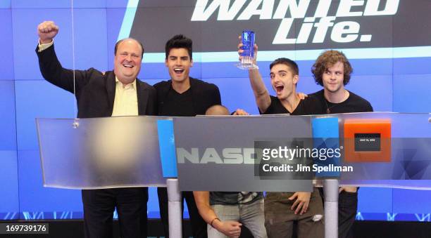 David Wicks Vice President of NASDAQ Marketsite, singers Siva Kaneswaran, Max George, Tom Parker and Jay McGuiness of The Wanted ring the closing...