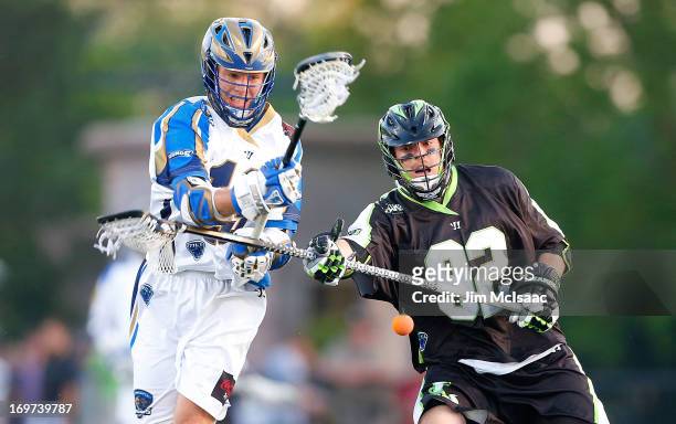 Michael Skudin of the New York Lizards battles for a loose ball against Kevin Drew of the Charlotte Hounds during their Major League Lacrosse game at...