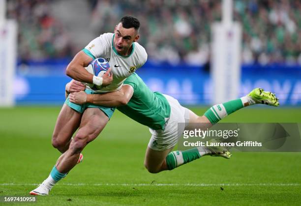 Jesse Kriel of South Africa is tackled by Garry Ringrose of Ireland during the Rugby World Cup France 2023 match between South Africa and Ireland at...