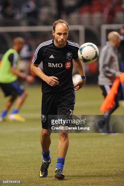 Justin Mapp of the Montreal Impact runs during warm-ups prior to a match against the Vancouver Whitecaps during the finals of the Amway Canadian...