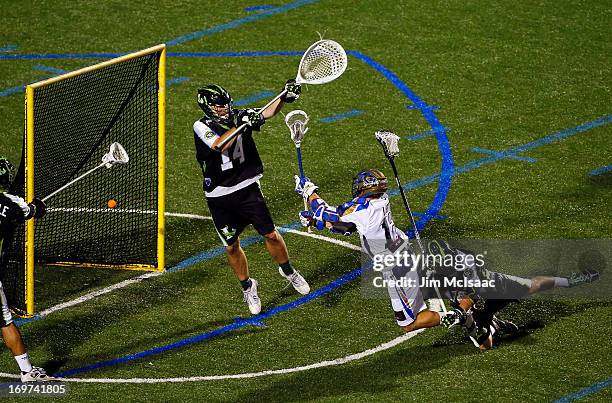 Eric Lusby of the Charlotte Hounds scores the game-winning goal in the fourth quarter past Drew Adams and Michael Skudin of the New York...