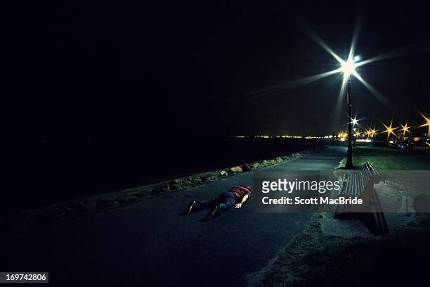 face down on the sea front - scott macbride stock pictures, royalty-free photos & images