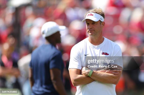 Head coach Lane Kiffin of the Mississippi Rebels looks on during warmups prior to facing the Alabama Crimson Tide at Bryant-Denny Stadium on...