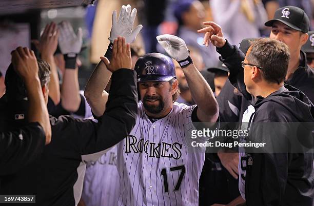 Todd Helton of the Colorado Rockies celebrates his pinch hit two run homerun to tie the score 5-5 with the Los Angeles Dodgers in the bottom of the...