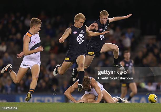 Josh Bootsma and Dennis Armfield of the Blues compete for the ball during the round ten AFL match between the Carlton Blues and the Greater Western...