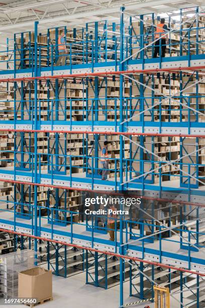 interior of a large industrial warehouse - verdieping stockfoto's en -beelden