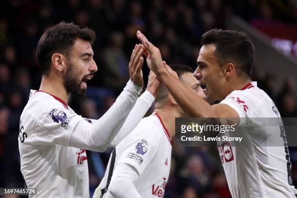 Bruno Fernandes of Manchester United celebrates with team mate Sergio Reguilon after scoring their sides first goal during the Premier League match...