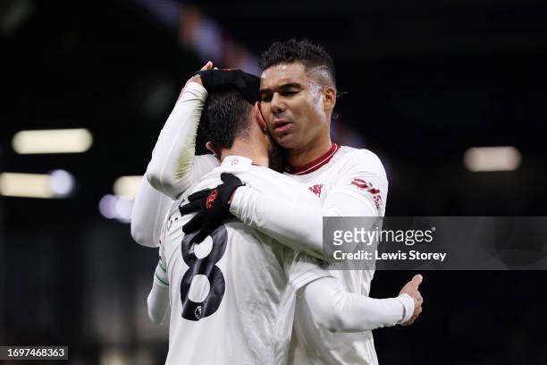 Bruno Fernandes of Manchester United celebrates with team mate Casemiro after scoring their sides first goal during the Premier League match between...