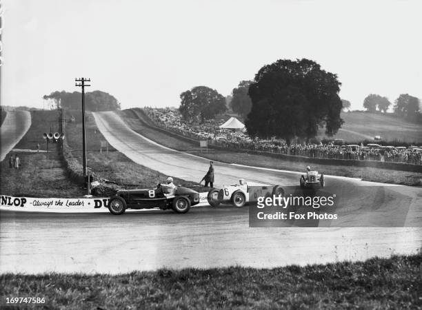 Competitors in the Donington Grand Prix at Donington Park, 2nd October 1937. Left to right: Raymond Mays of Great Britain in an ERA, Rudolf Hasse of...