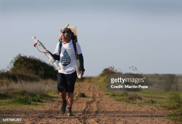 Dr Charlie Gardner walks among the dunes adjacent to the beach during a walk to highlight climate change on September 29, 2023 in Snettisham, United...