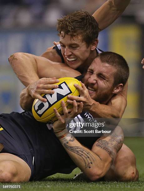 Zach Tuohy of the Blues is tackled during the round ten AFL match between the Carlton Blues and the Greater Western Sydney Giants at Etihad Stadium...