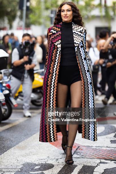 Paola Turani is seen wearing a black bodysuit and long Missoni coat outside the Missoni show during Milan Fashion Week Womenswear Spring/Summer 2024...