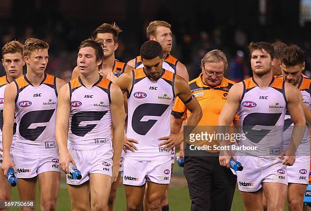 Kevin Sheedy, the coach of the Giants and his players leave the ground after losing the round ten AFL match between the Carlton Blues and the Greater...
