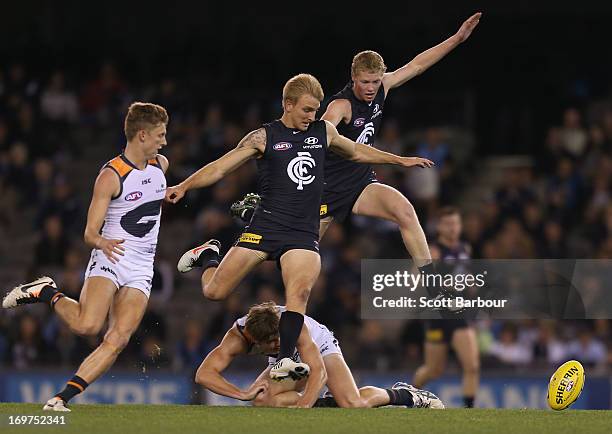 Josh Bootsma and Dennis Armfield of the Blues compete for the ball during the round ten AFL match between the Carlton Blues and the Greater Western...