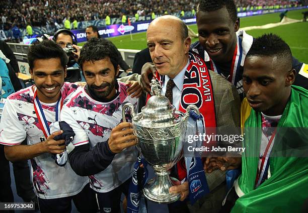 Benoit Tremoulinas, Fahid Ben Khalfallah, Alain Juppe, Mayor of Bordeaux, holding the trophy, Cheick Diabate, Andre Biyogo Poko celebrate their 3-2...