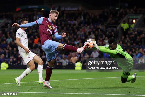 Jacob Bruun Larsen of Burnley has a shot saved by Andre Onana of Manchester United during the Premier League match between Burnley FC and Manchester...