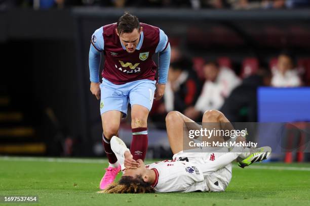 Connor Roberts of Burnley reacts as Hannibal Mejbri of Manchester United lays injured during the Premier League match between Burnley FC and...