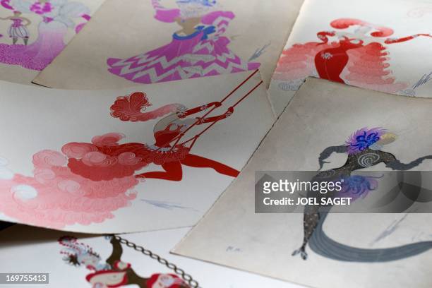 Picture taken in Paris, on May 31 shows various drawings by Franco-Russian artist Romain de Tirtoff, also known as 'Erte'. Over 300 drawings by...