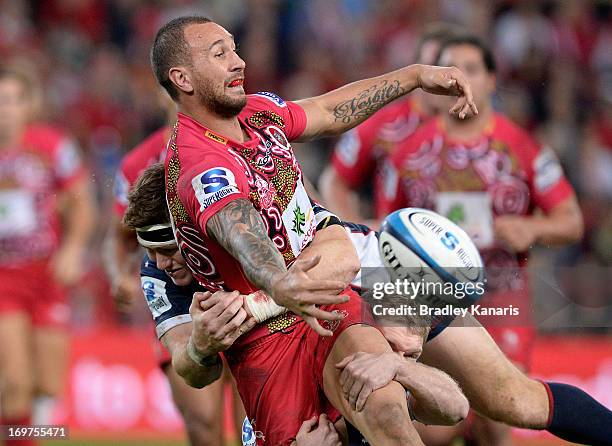 Quade Cooper of the Reds gets a pass away during the round 16 Super Rugby match between the Reds and the Rebels at Suncorp Stadium on June 1, 2013 in...