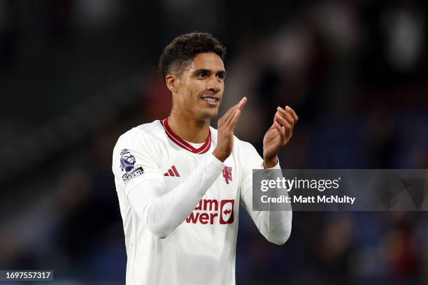 Raphael Varane of Manchester United applauds fans following their sides victory in the Premier League match between Burnley FC and Manchester United...