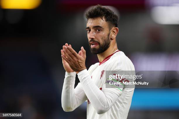 Bruno Fernandes of Manchester United applauds fans following their sides victory in the Premier League match between Burnley FC and Manchester United...