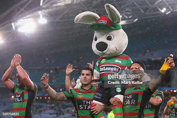 Adam Reynolds and Issac Luke of the Rabbitohs carry Charlie Gallico the Rabbitohs mascot "Reggie" as they celebrate with the crowd after victory...