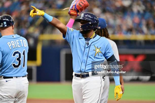 Junior Caminero of the Tampa Bay Rays reacts after hitting single in the third inning against the Toronto Blue Jays during his Major League Debut at...