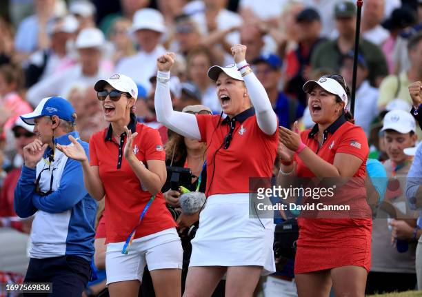 United States vice-captain Morgan Pressel celebrates another American point with Cheyenne Knight and Lilia Vu during the afternoon four-ball matches...