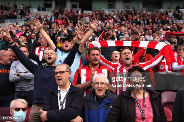 Brentford fans show their support during the Premier League match between Brentford FC and Everton FC at Brentford Community Stadium on September 23,...