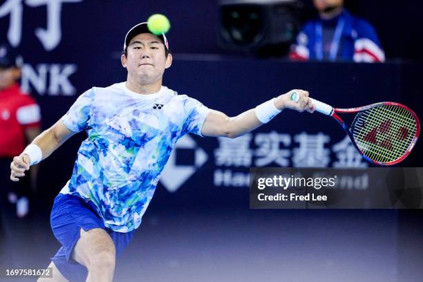 Yoshihito Nishioka of Japan returns a shot in his match against Juncheng Shang of China on day 4 of the 2023 China Open at at National Tennis Center...