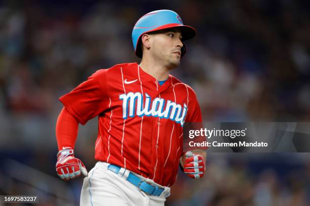 Nick Fortes of the Miami Marlins hits a sacrifice fly to center during the fourth inning against the Milwaukee Brewers at loanDepot park on September...