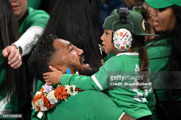 Bundee Aki of Ireland celebrates victory with a child after defeating South Africa during the Rugby World Cup France 2023 match between South Africa...